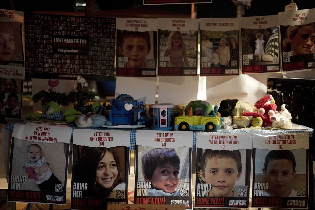 Israel Palestinians Posters of children held hostage by Hamas in the Gaza Strip are displayed with toys