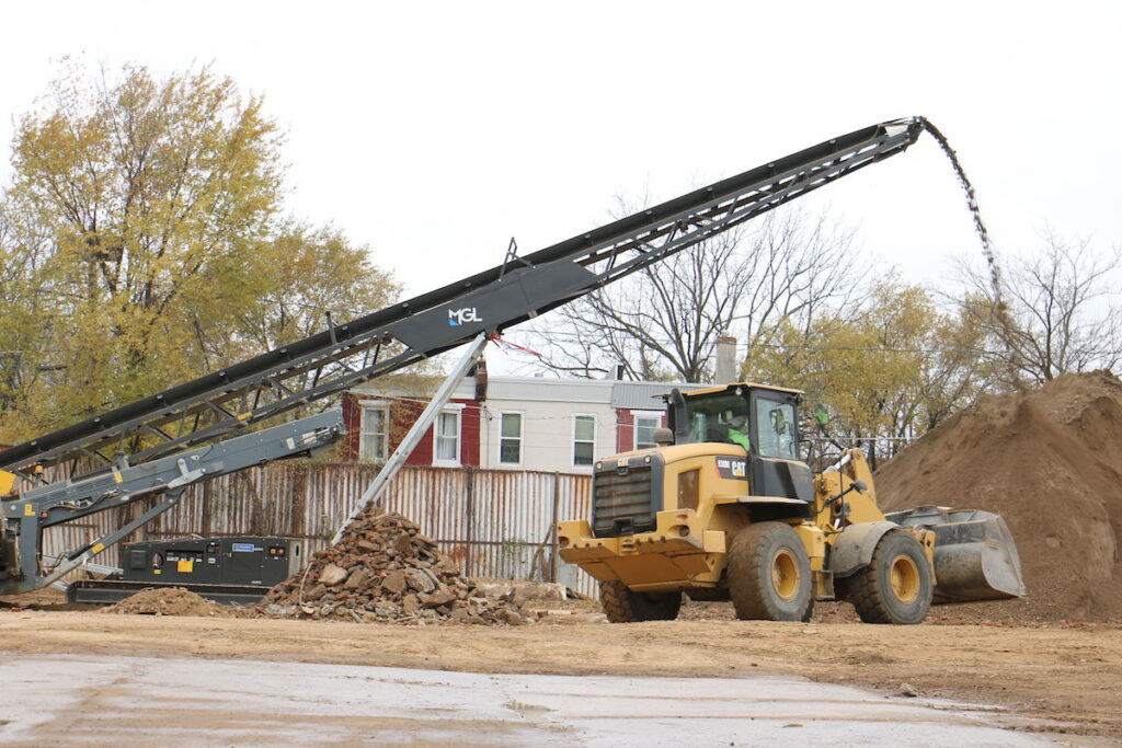 The illegal dump at Seventh and Chestnut streets in Camden is surrounded by houses.