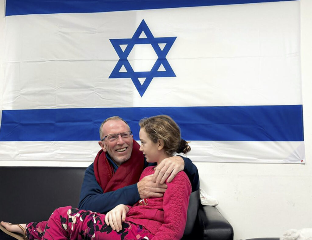 Israel Palestinians A father and daughter hug after being reunited.