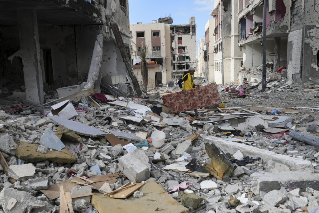 Israel Palestinians wreckage after a bombing.