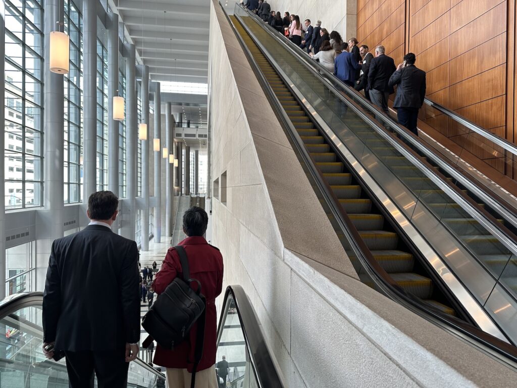 people going up an escalator