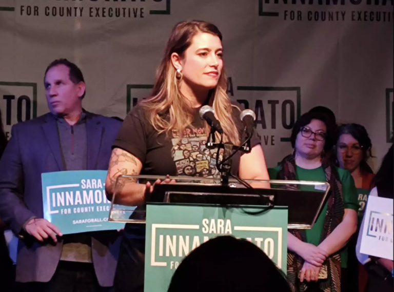 Sara Innamorato speaking at a podium