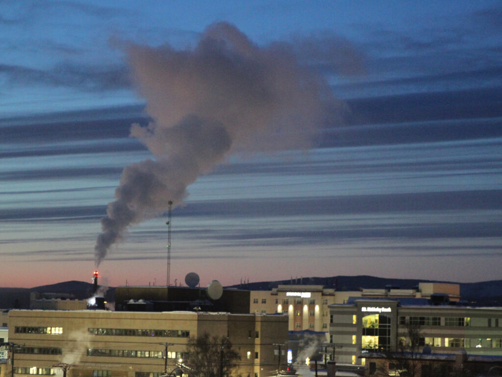 Emissions from a power plant in Fairbanks, Alaska, in 2022. Global emissions of planet-warming greenhouse gases increased between 2021 and 2022, according to a new report from the United Nations. power plant emissions against the sky