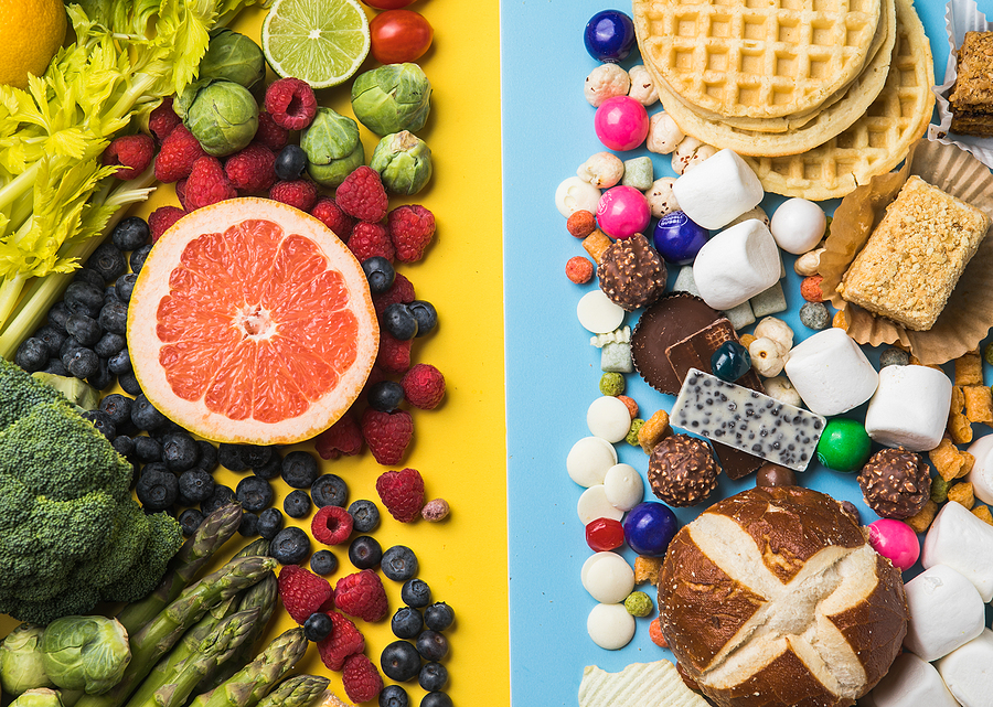 Healthy And Unhealthy Food Background From Fruits And Vegetables Healthy and unhealthy food background from fruits and vegetables vs fast food, sweets and pastry top view. Diet and detox against calorie and overweight lifestyle concept.