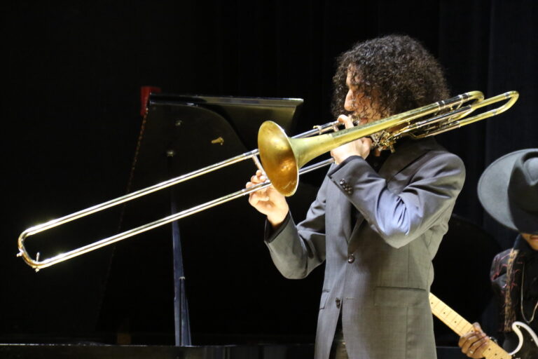 A student plays the trombone