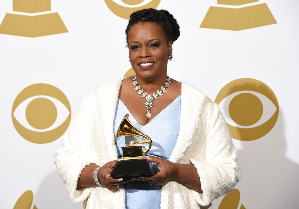 Dianne Reeves poses for a photo while holding up her Grammy award.