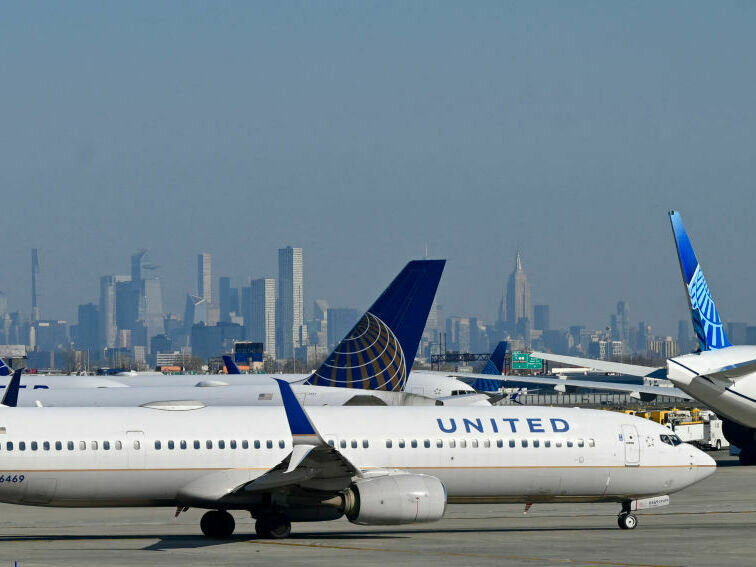 US-TRAVEL-HOLIDAYS United Air Lines planes line up along the busy Newark Liberty International Airport, New Jersey, on the eve of Thanksgiving on November 23, 2022. Daniel Slim/AFP via Getty Images