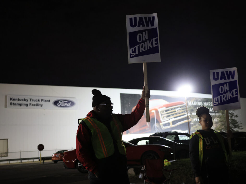 Workers form a picket line outside the Ford Motor Co. Kentucky Truck Plant in the early morning hours on October 12, 2023 in Louisville, Kentucky. This week, a majority of workers at the plant voted no on the tentative contract deal. Workers form a picket line outside the Ford Motor Co. Kentucky Truck Plant in the early morning hours on October 12, 2023 in Louisville, Kentucky. This week, a majority of workers at the plant voted no on the tentative contract deal.