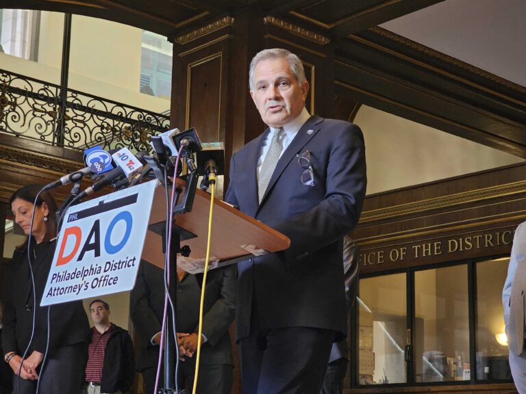 Larry Krasner speaking at a podium