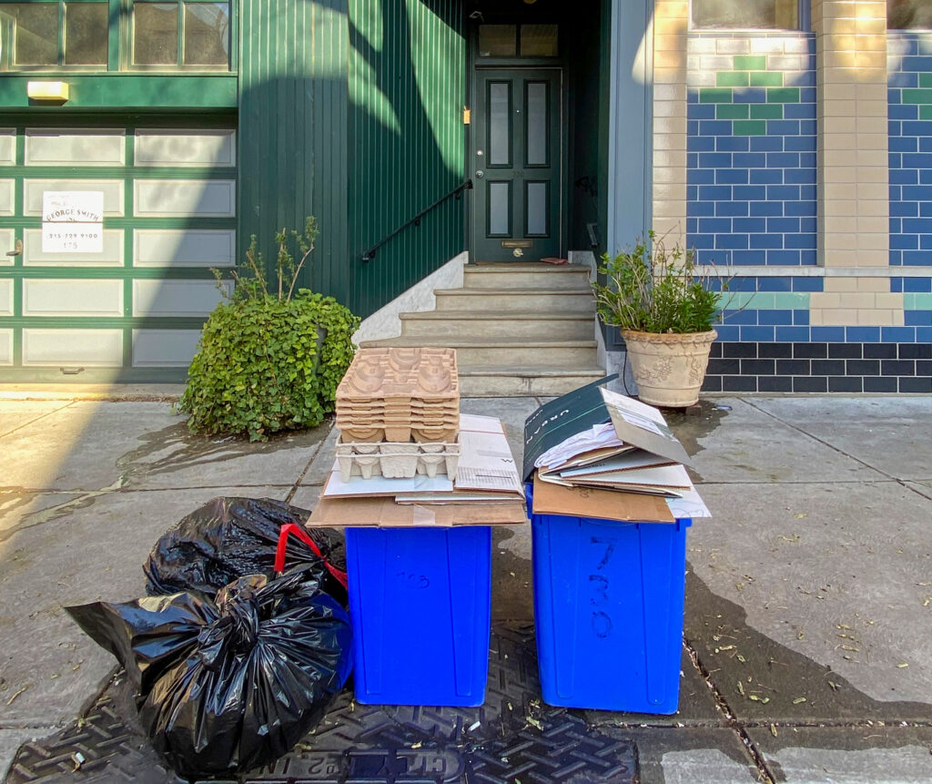 recyclingtrash-03 Recycling awaiting pickup in the Queen Village neighborhood, next to trash.