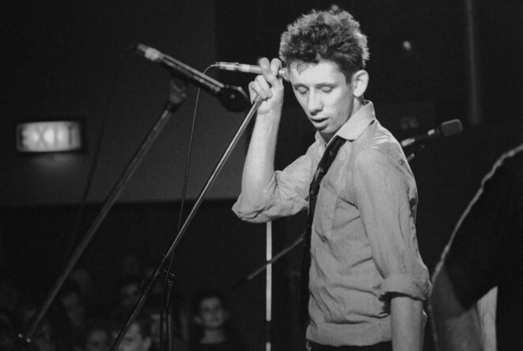 shane-macgowan-npr-2023-11-30 Shane MacGowan performing on stage