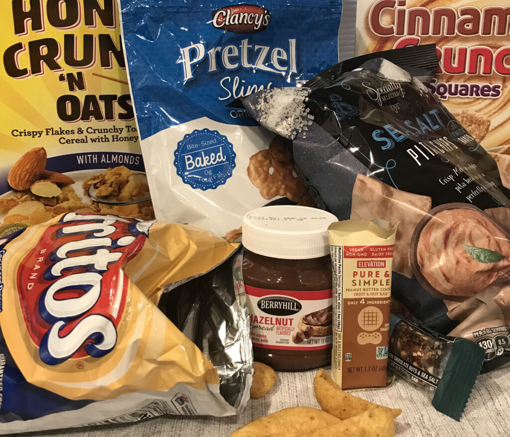 snack_foods1200 Physician Chris van Tulleken says ultra-processed foods — like cereals, cheese puffs, or protein bars — package sugar, salt, and fat into massive doses of calories — that are not healthy for us. (Maiken Scott/WHYY)