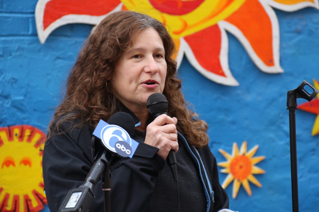 Silvana Mazzella speaks into a microphone
