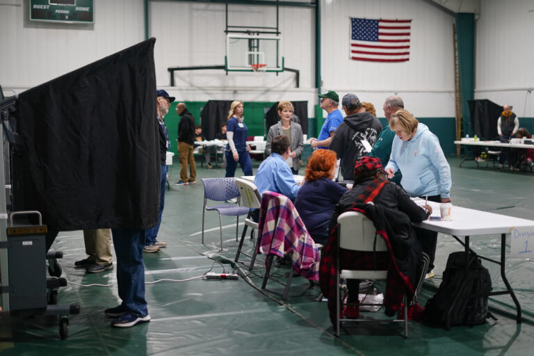 Voters check in at their polling place before casting their ballots on election day in Philadelphia, Tuesday, Nov. 7, 2023.