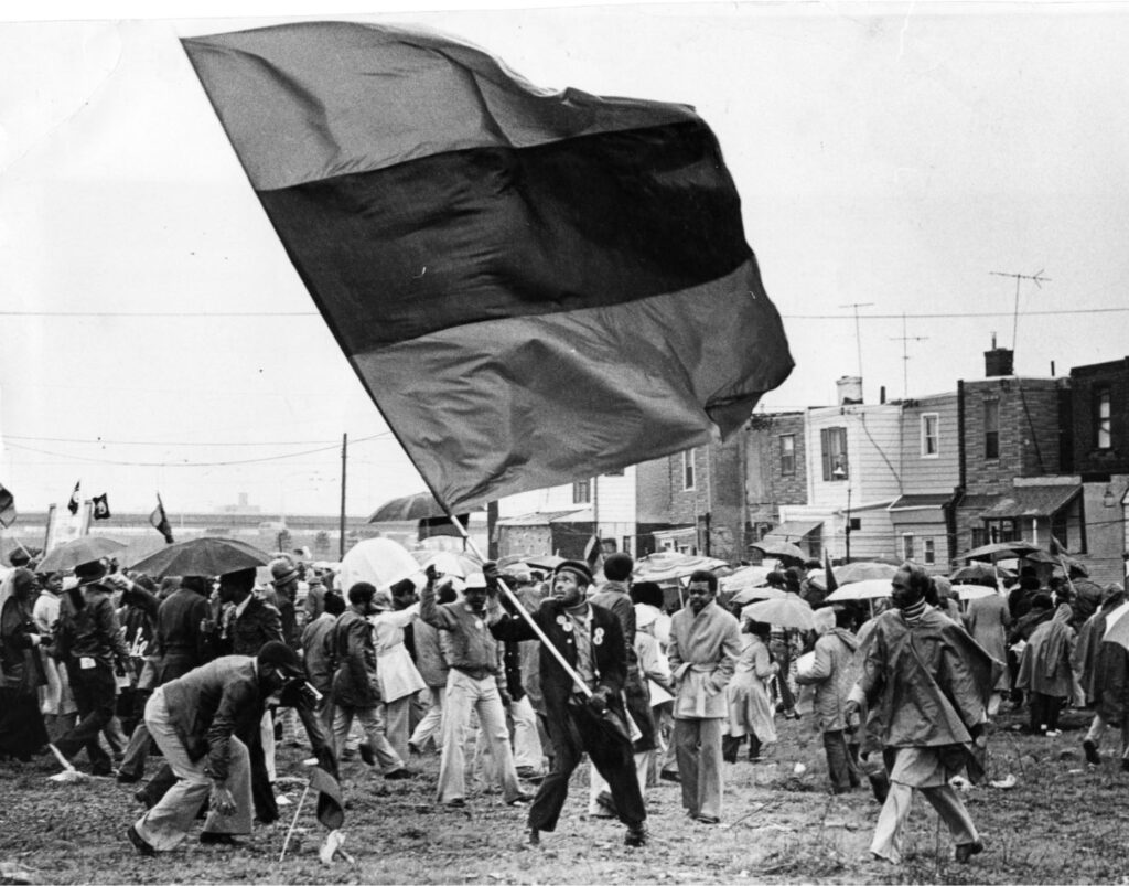 whitmanpark-protest-housing-umbrellas Housing activist Milton Street and some 1,500 of his supporters during a 1979 rally they held at Whitman Park in South Philadelphia.