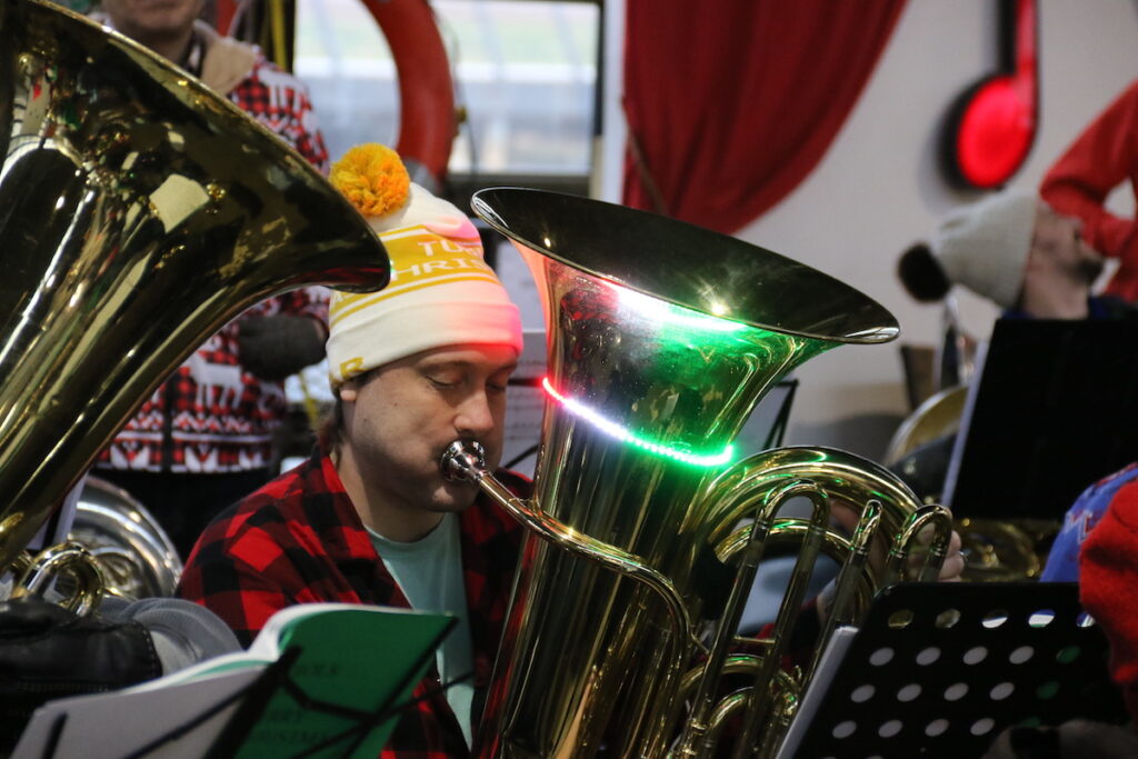 019A2643 All types of horns could be seen and heard during the TubaChristmas concert at Cherry Street Pier on Dec. 17, 2023. (Cory Sharber/WHYY)