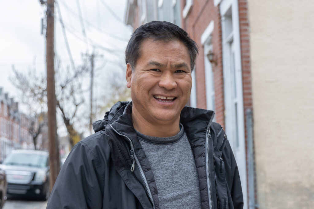 Tsering Parshingtsang smiles, posing for a photo