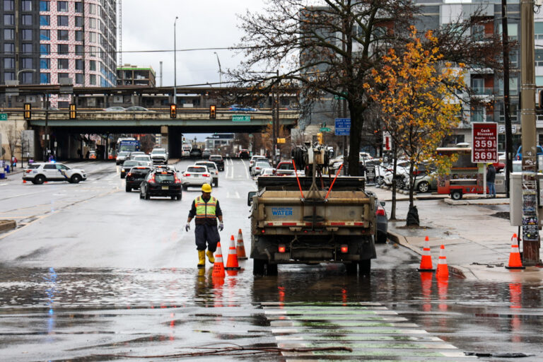 File photo: Clogged gutters at Delaware Ave. and Spring Garden Street in Philadelphia cause road closures after a storm brought heavy rain to the region and the Delaware River overflowed onto the road on December 18, 2023. (Kimberly Paynter/WHYY)