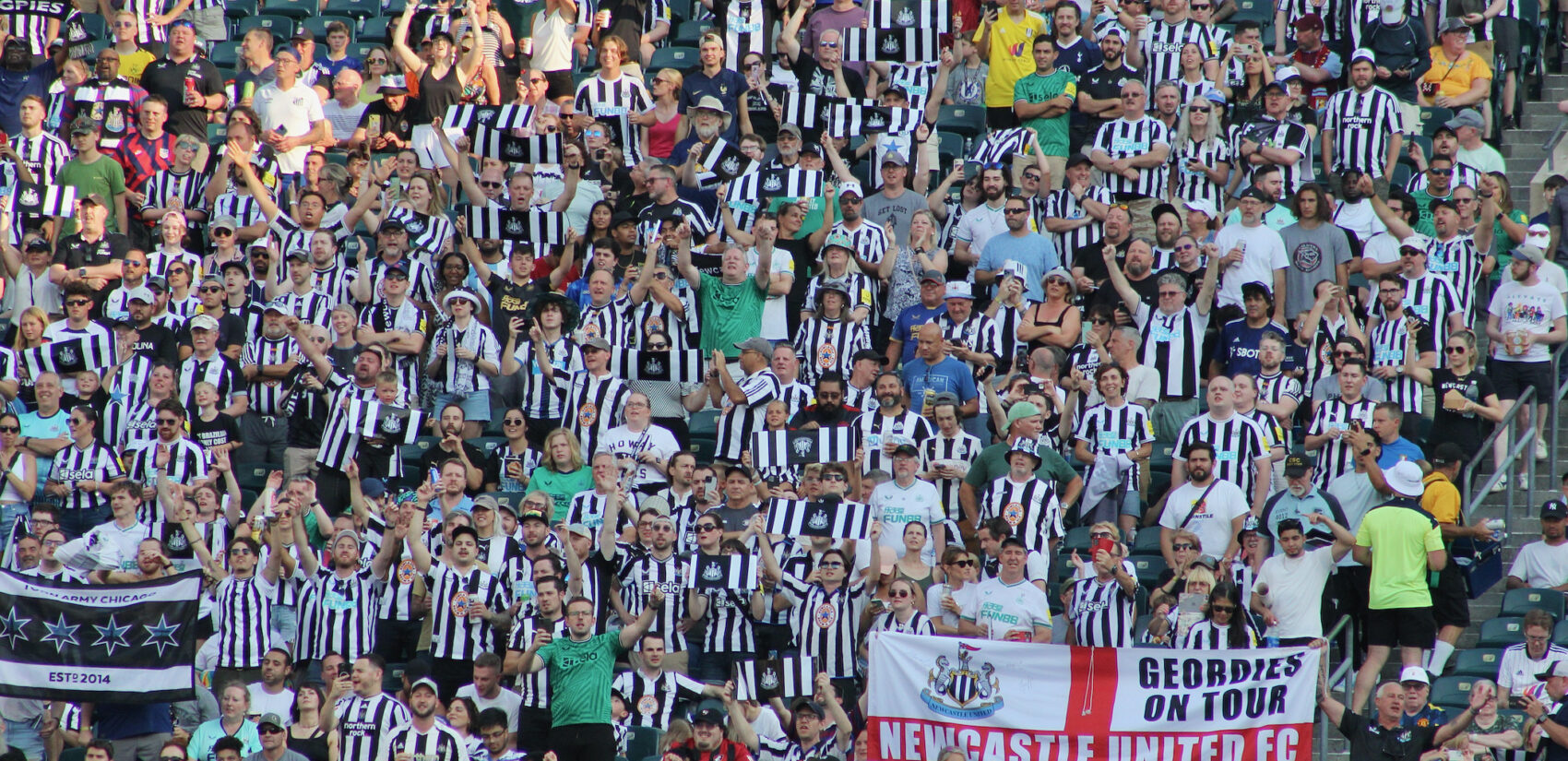 Newcastle United fans cheering their team at Lincoln F