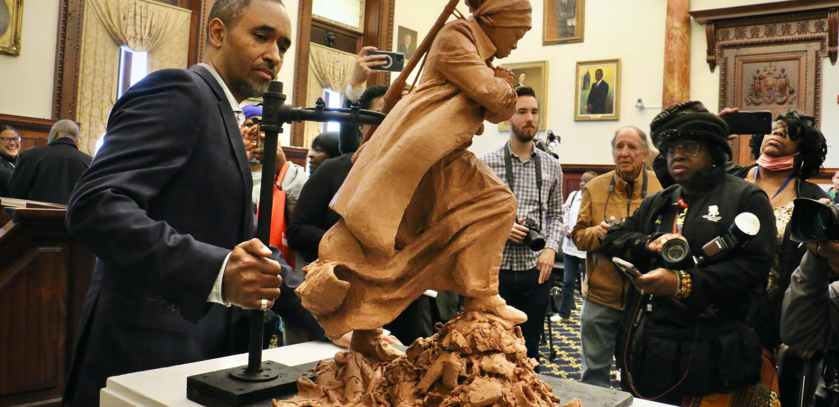 Alvin Pettit poses with his design for the Harriet Tubman statue