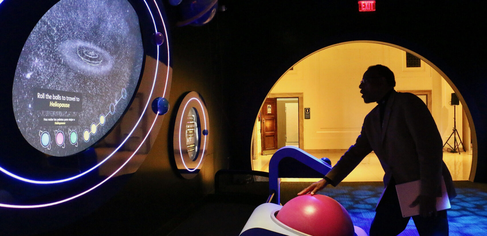 Derrick Pitts displays a tool at the exhibit