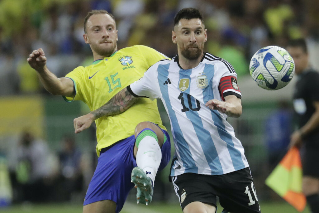 APTOPIX Brazil Argentina Wcup 2026 Soccer Argentina's Lionel Messi (right) and Brazil's Carlos Augusto battle for the ball during a qualifying soccer match for the FIFA World Cup 2026 at Maracana stadium in Rio de Janeiro, Brazil, Tuesday, Nov. 21, 2023