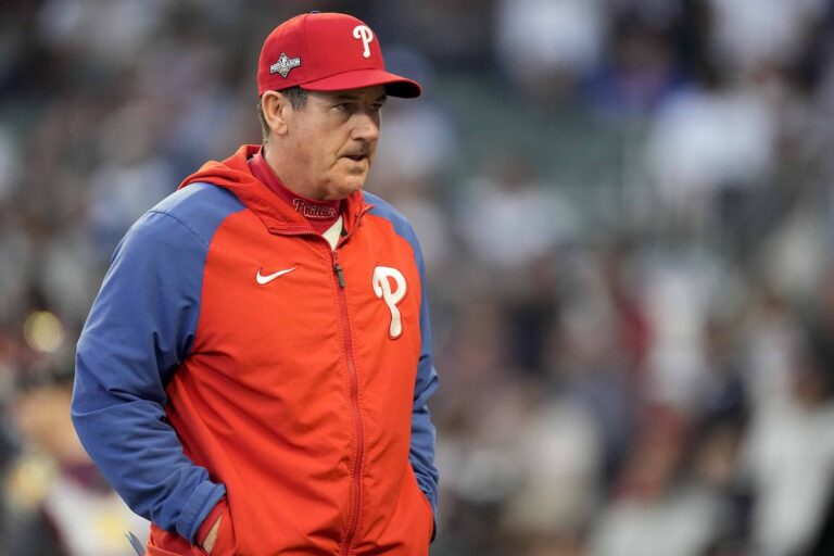 Philadelphia Phillies Manager Rob Thomson walks to the mound during the fourth inning of Game 1 of a baseball NL Division Series against Atlanta Braves, Oct. 7, 2023, in Atlanta.