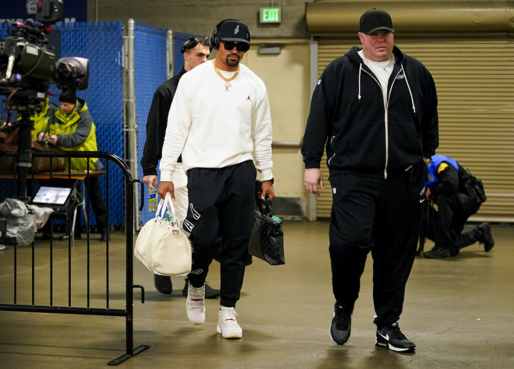 Eagles Seahawks Football Philadelphia Eagles quarterback Jalen Hurts (left) arrives with chief security officer Dom DiSandro, right, before an NFL football game against the Seattle Seahawks, Monday, Dec. 18, 2023, in Seattle.
