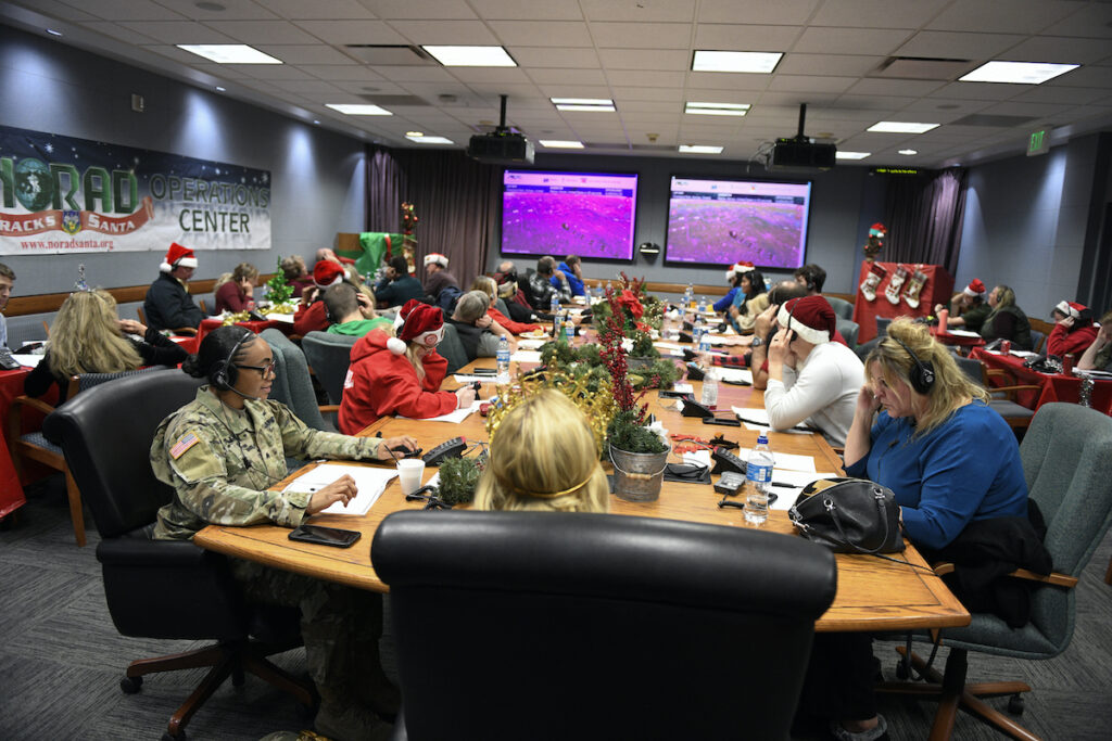 Tracking Santa This image provided by the Department of Defense shows volunteers answering phones and emails from children around the globe during the annual NORAD Tracks Santa event on Peterson Air Force Base in Colorado Springs, Colo., Dec. 24, 2022.