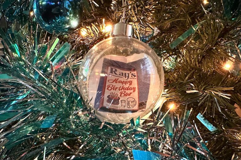 Customized ornaments decorate the Christmas tree at Ray's. (Ali Mohsen/Billy Penn)