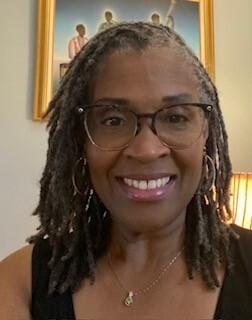 Muriel Alston smiles, posing for a photo