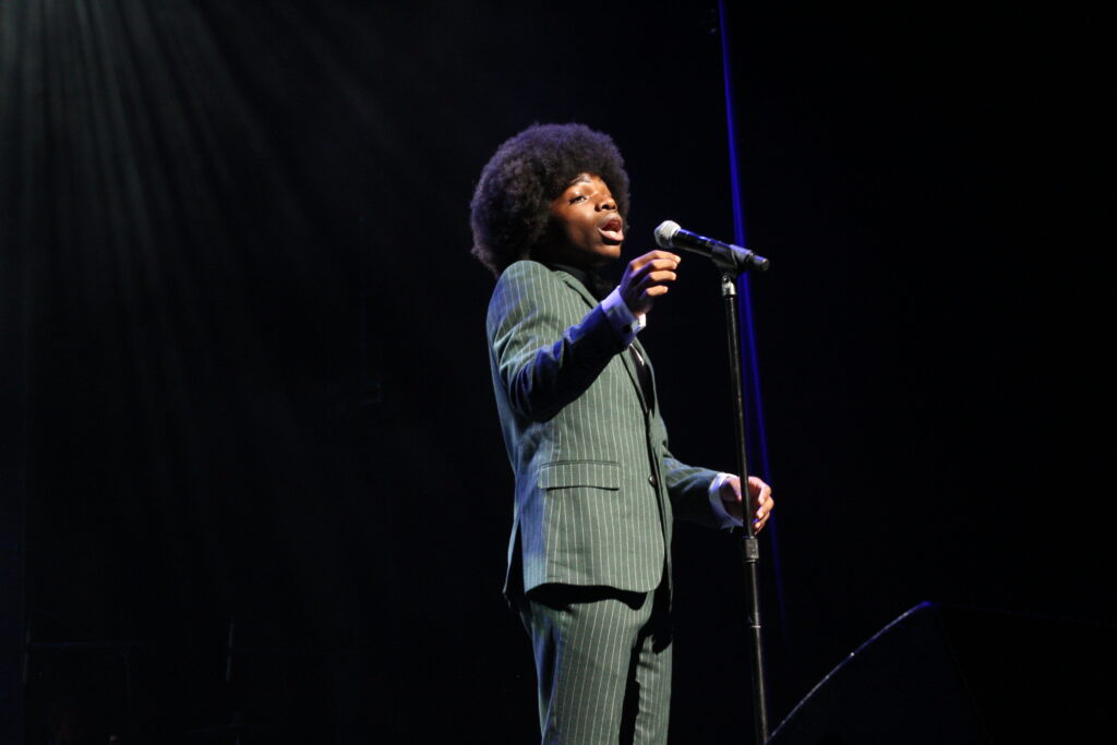 Nathanael sings 3 Nathanel Barlow on stage