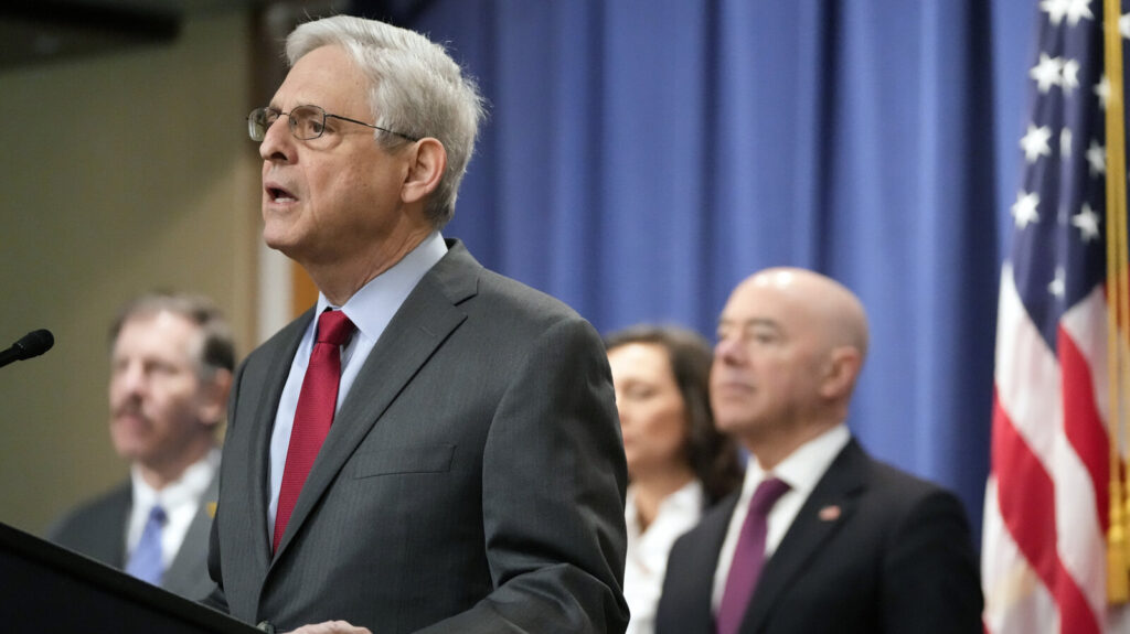 Justice Department Russia Ukraine War Crimes Attorney General Merrick Garland speaks with reporters during a news conference at the Department of Justice on Wednesday as Secretary of Homeland Security Alejandro Mayorkas, right, looks on. Mark Schiefelbein/AP