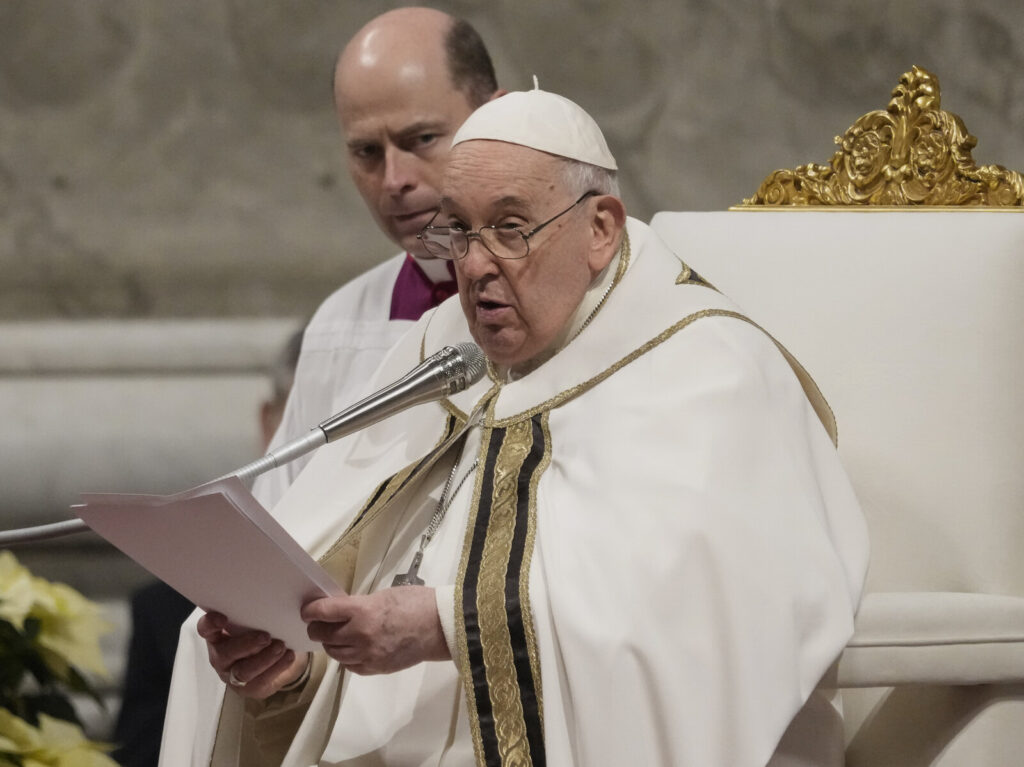 Pope Francis presides over Christmas eve Mass, at St. Peter's Basilica at the Vatican, on Sunday. (Gregorio Borgia/AP)