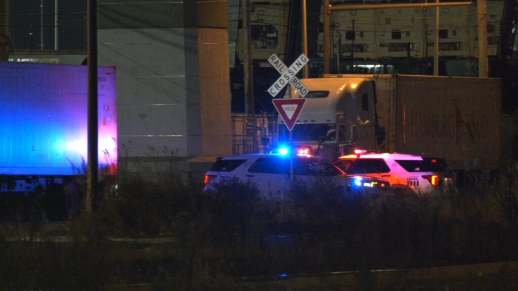 Police on the scene of a partial train derailment