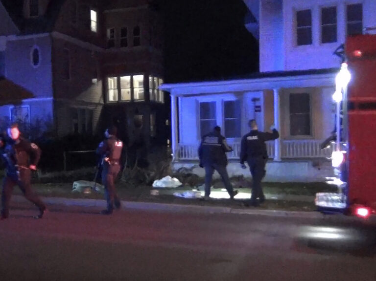 In a still frame from video law enforcement officers investigate the scene of a shooting late last month in Burlington, Vt.