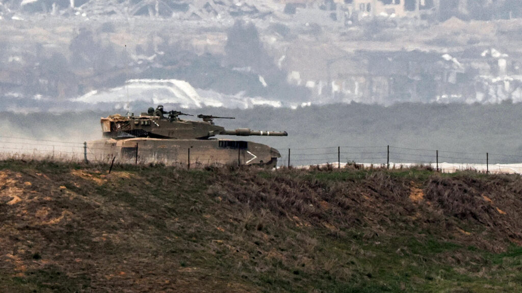 ISRAEL-PALESTINIAN-CONFLICT An Israeli battle tank moves along the border between the Gaza Strip and southern Israel on Wednesday as battles between Israel and Hamas continue. (Jack Guez/AFP via Getty Images)