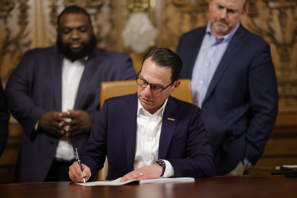 gov-shapiro-signing-bill-spotlight-pa Gov. Shapiro signing a bill at his desk