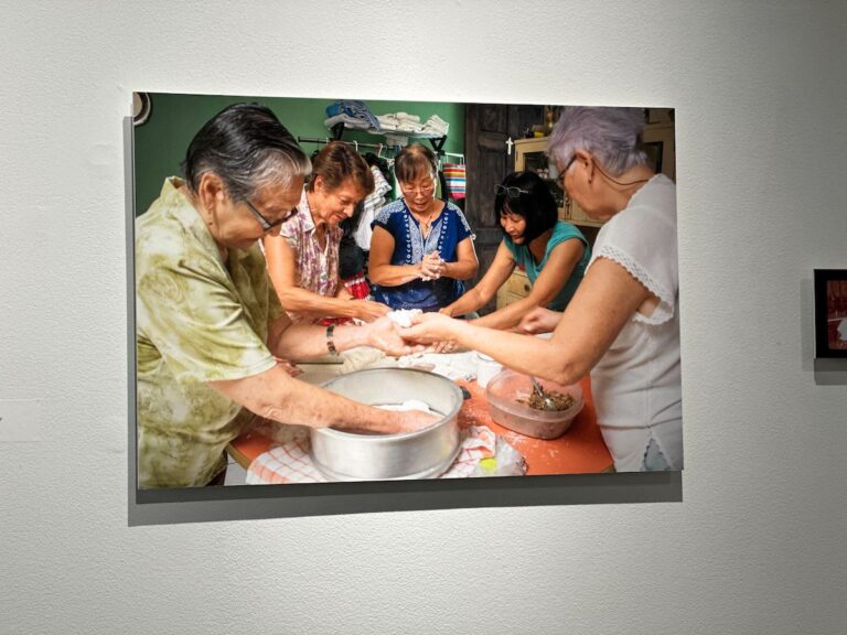 A photo of a group of Chinese-Costa Ricans making a traditional Cantonese dish with Costa Rican ingredients.