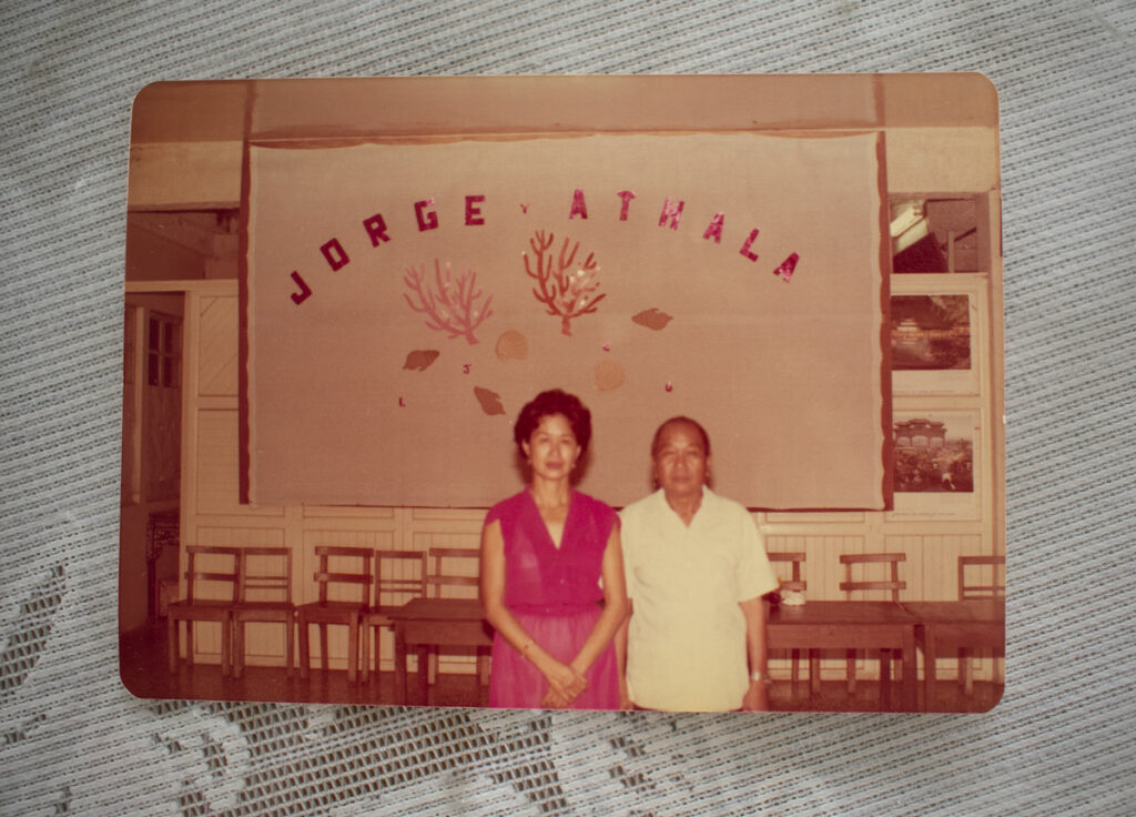 A photo of a couple below a sign that reads Jorge Athala