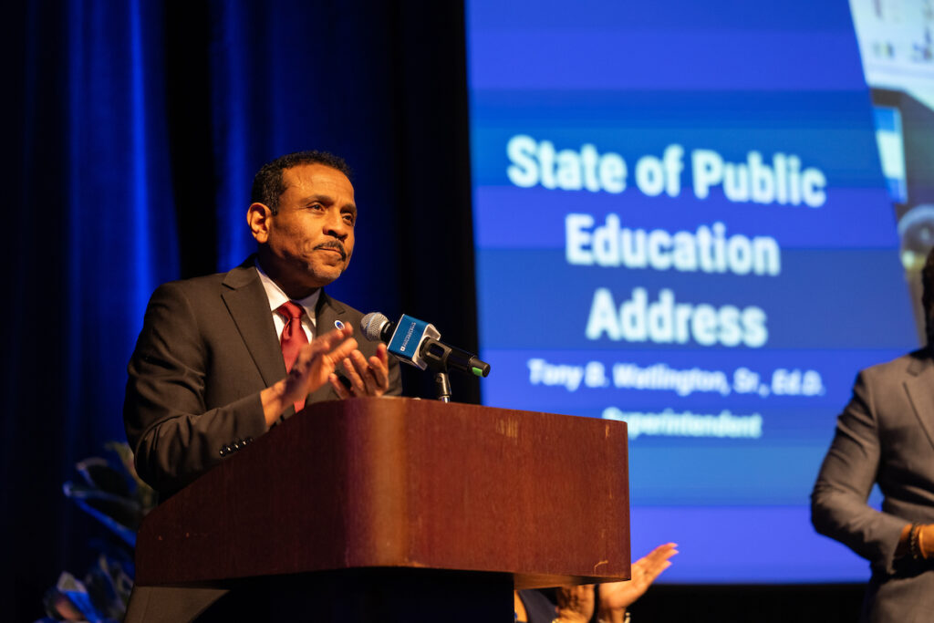 Philadelphia Superintendent Tony Watlington speaks into a microphone at a podium