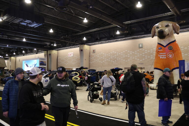 Don't worry, the dog overlooking the Philadelphia Auto Show doesn't bite.