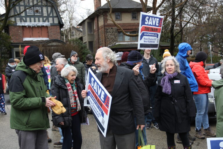 Community members across all ages made signs and showed their support for the Chestnut Hill West Regional Line during a ''rally and ride'' at the Richard Allen Lane SEPTA station on Jan. 28, 2024. (Cory Sharber/WHYY)
