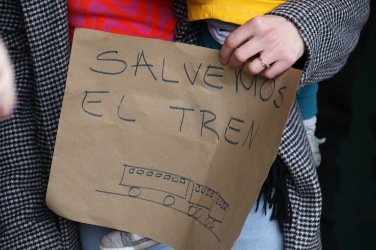 Community members across all ages made signs and showed their support for the Chestnut Hill West Regional Line during a ''rally and ride'' at the Richard Allen Lane SEPTA station on Jan. 28, 2024. (Cory Sharber/WHYY)