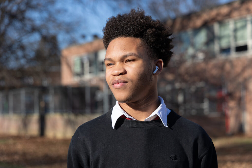 12 21 2023 k paynter northeast high school student joshua scotland-2 Joshua Scotland poses for a photo outside of Northeast High School