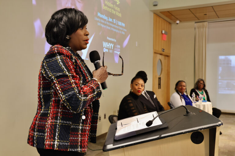 Cherelle Parker speaking at a podium during a panel discussion