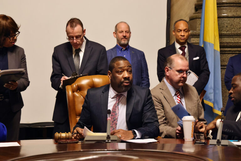 Philadelphia City Council President Kenyatta Johnson seated at a round table, conducting a caucus meeting