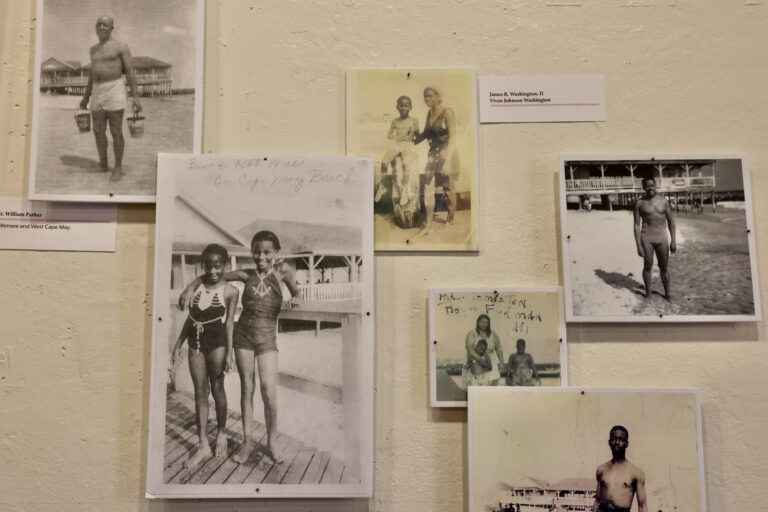 A collection of family photographs donated to Cape May's Center for Community Arts are on display at the historic Emlen Physick estate. They chronicle life at Cape May's segregated Grant Street Beach. (Emma Lee/WHYY)