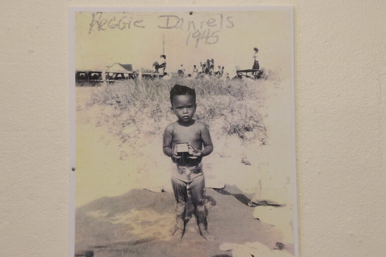 A snapshot taken on Grant Street Beach in 1945 shows Reggie Daniels, interrupted from play  to pose for a picture. (Emma Lee/WHYY)