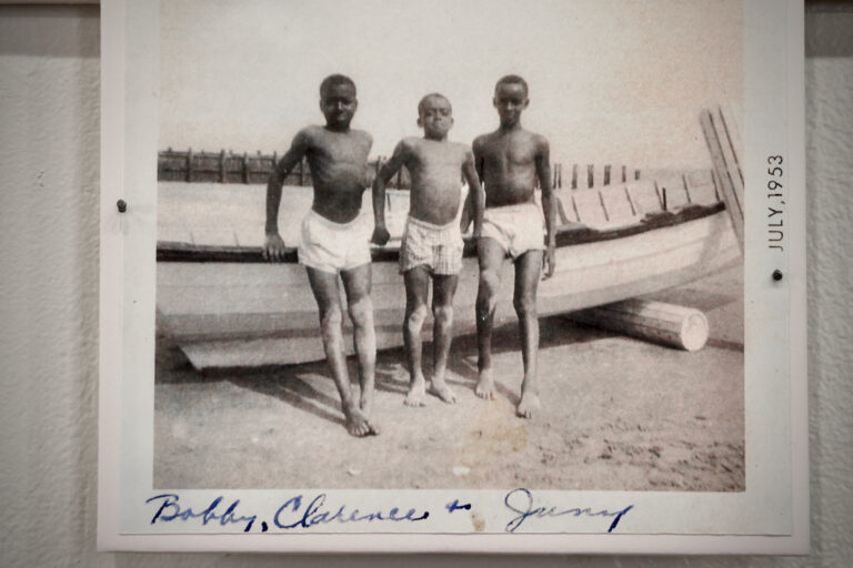 In a photo from 1953, boys puff out their chests for the photographer on Grant Street Beach. (Emma Lee/WHYY)